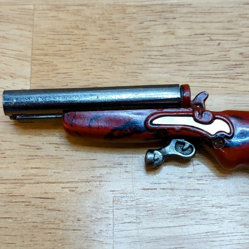 Vintage Toy Pistol with Red and Silver Finish